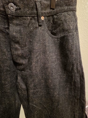 Customer's Easy Guy Mezuki Selvedge denim jeans, close-up of the textured black fabric.