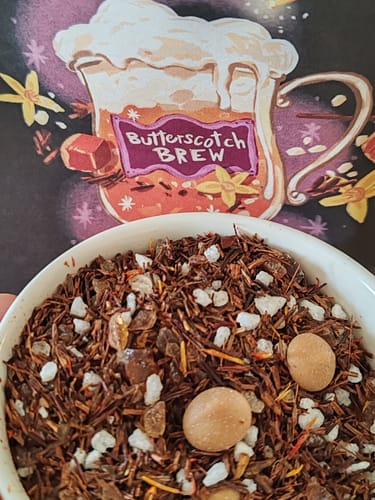Customer's Butterscotch Brew Special Edition tea leaves in a white bowl in front of the product packaging