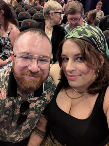 Reviewer wearing a Choice Ferns Silky Scarf as a colorful head wrap at an event.