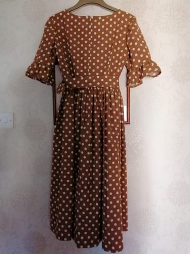 Customer's dress made from the printed cotton fabric, featuring a brown background with white polka dots.