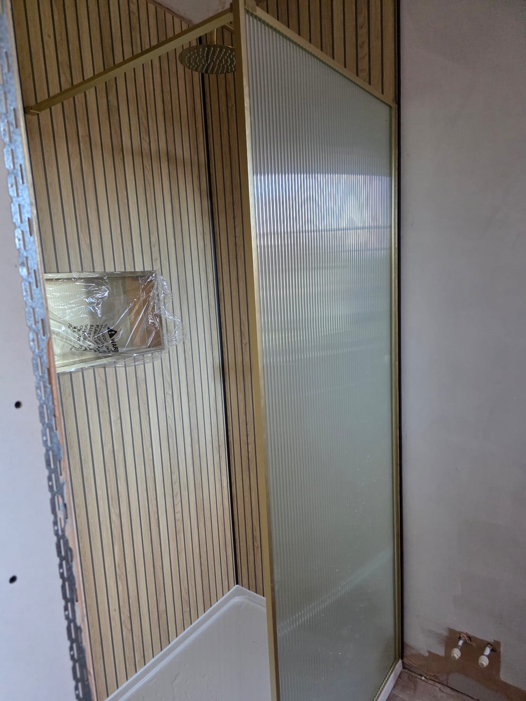 Customer photo review of Sivara Oak Slatted Wood Effect PVC Waterproof Shower Panel
