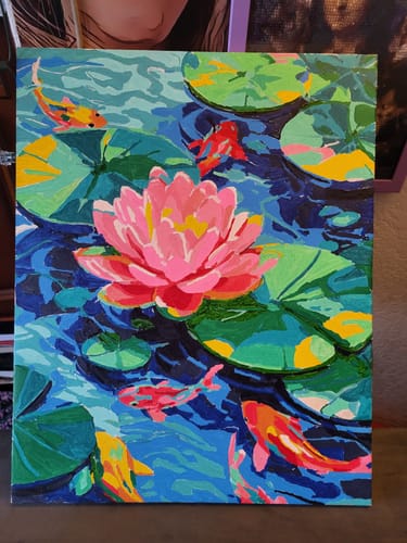 Customer's completed A Lotus bloom Paint by Number canvas featuring a vibrant pink lotus flower and orange koi fish.