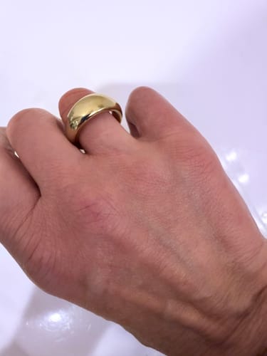 Reviewer's gold Chunky Dome Ring viewed from a top-down angle on a finger