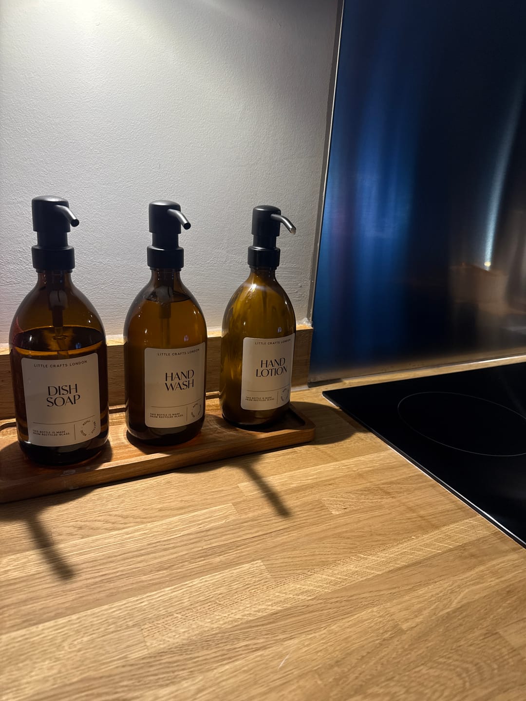 Customer photo review of Set of 3 Reusable Amber Glass Bottles 500 ML with Metal Pump and Long Tray