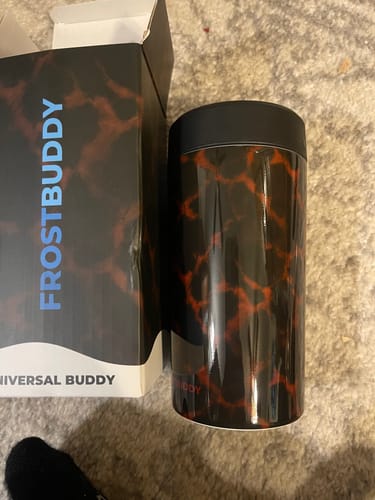 Customer's Amber Tortoise Universal Buddy can cooler next to its product box, showing visible white rim details.