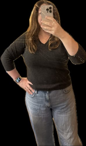 Customer's charcoal grey cashmere V-neck jumper worn by a person in a mirror selfie