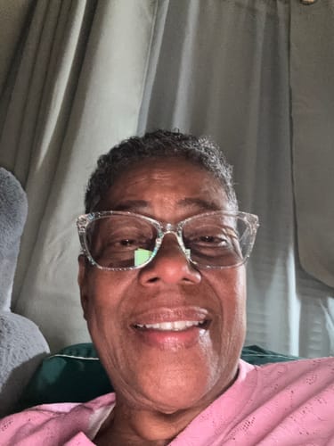 Customer's smiling face showing lips after using GLO MELANIN.