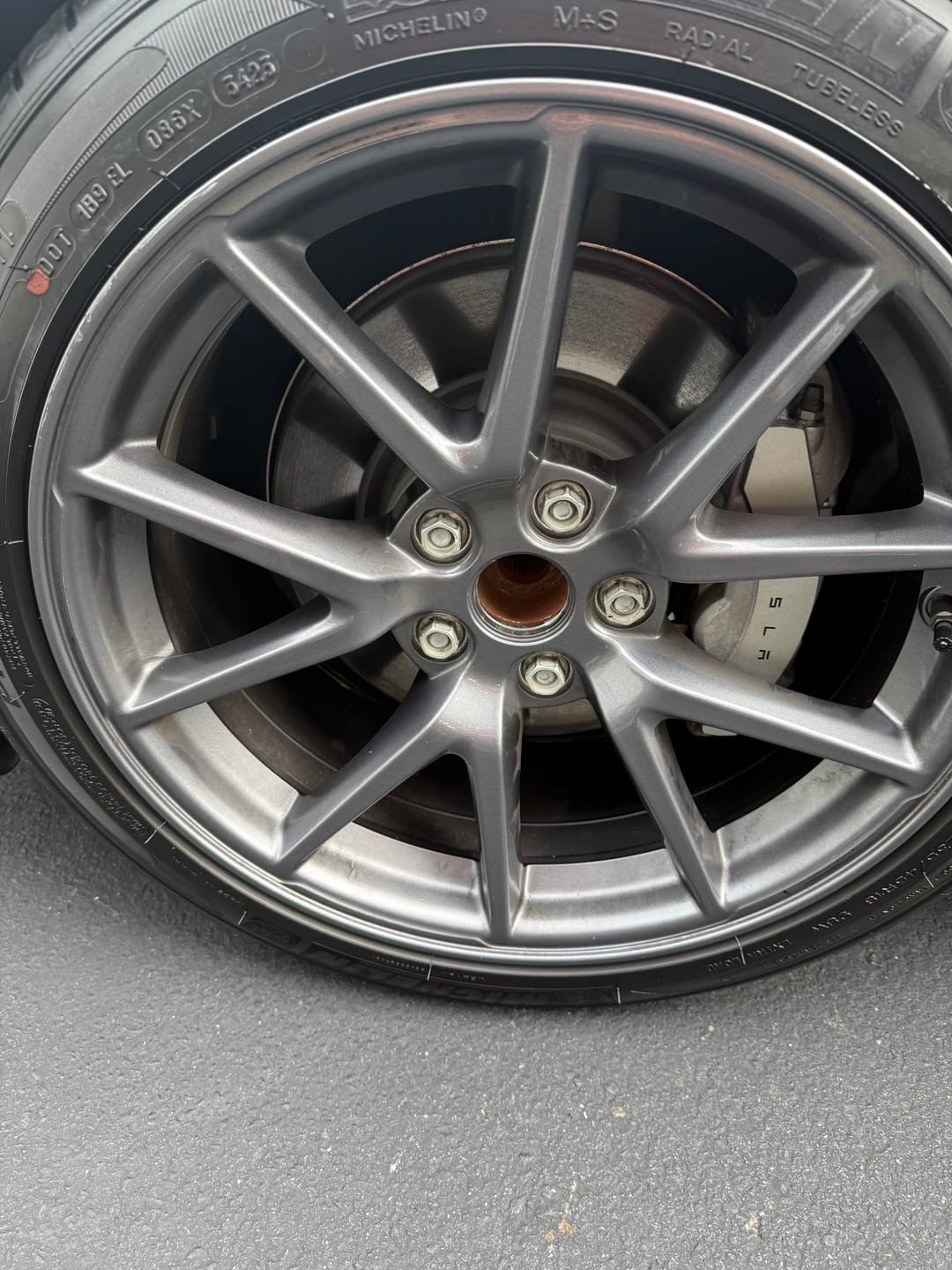 Customer photo review of Tesla Wheel Curb Rash Repair Kit for Model 3 18-inch Grey Aero Pinwheel Rims with Color-matched Touch-Up Paint