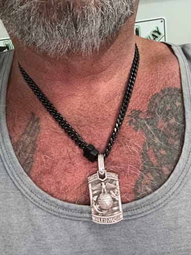 Customer's Legacy 8mm Cuban Link Chain worn around neck, featuring a silver military-style USMC pendant