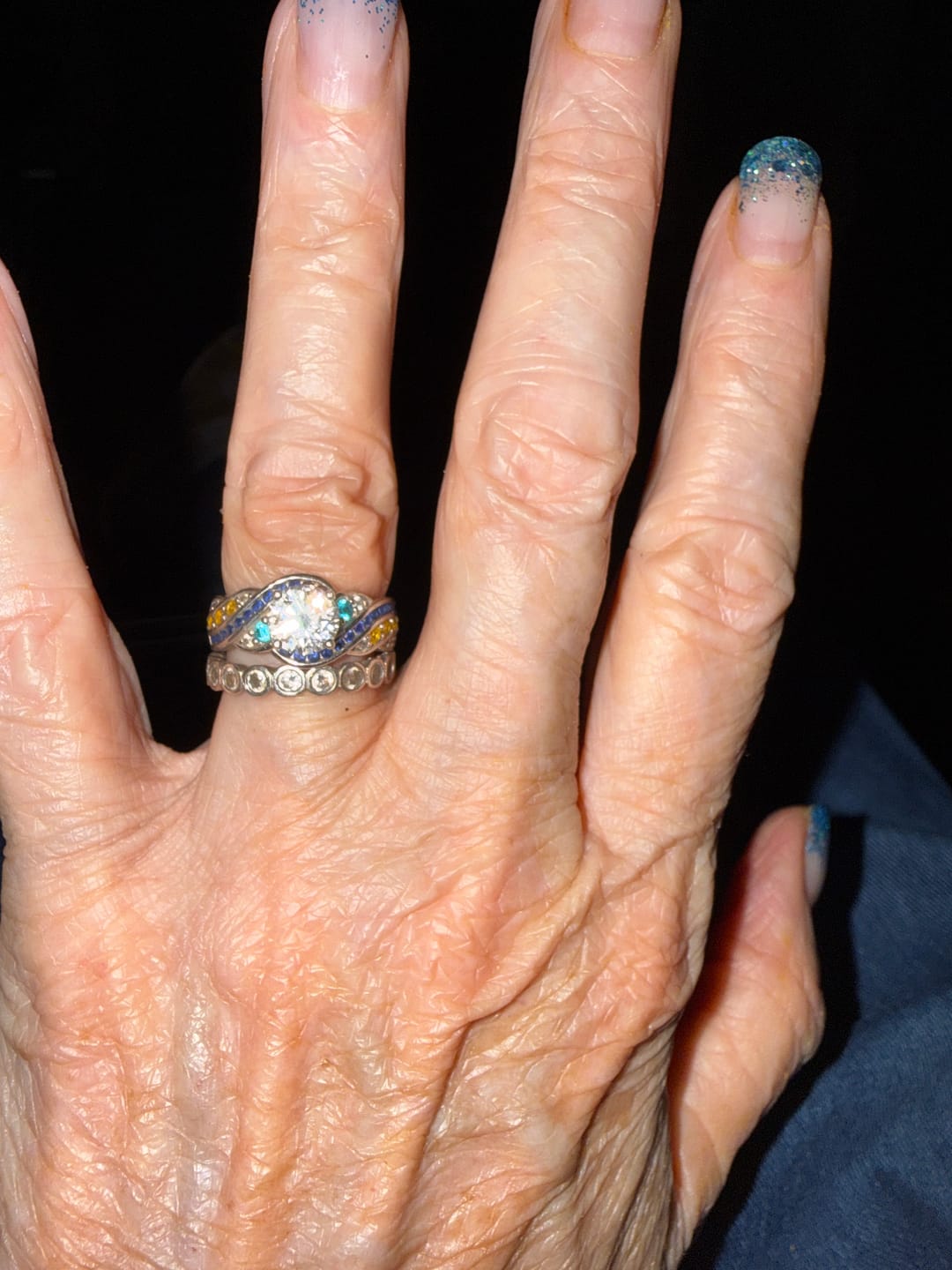 Customer photo review of Starry Night Moissanite Artistic Swirl Accent Engagement Ring