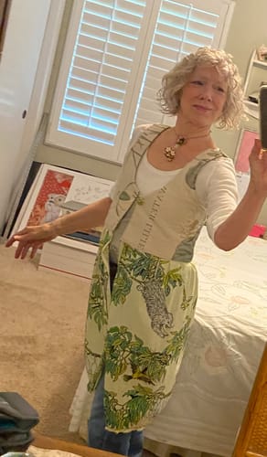 Reviewer wearing a custom vest made from Treetop Bandanas, featuring a green and cream opossum print.