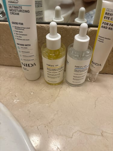 Customer's NIDA Super Deal Skincare set, showing four bottles and tubes received instead of seven.