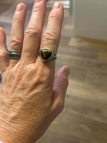 Customer's Alaula Gemstone Bold Ring with a brown tigers eye stone, worn on a hand.