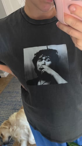 Customer's Coy Oversized Shirt in charcoal gray, worn in a mirror selfie with a dog visible in the lower corner.