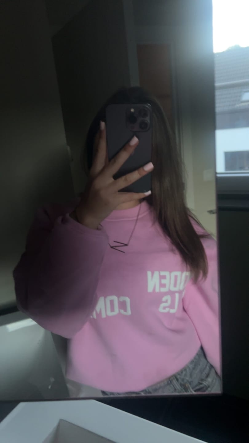 Customer photo review of the GATED COMMUNITY SWEATER in BUBBLEGUM PINK