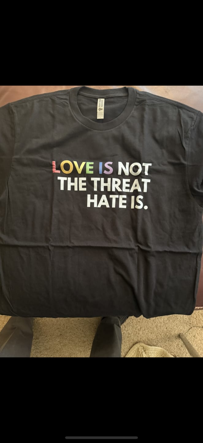 Customer photo review of Love is Not the Threat Pride Remix Unisex T-Shirt