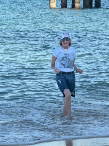 Customer's Shipping Protection package, person walking in the ocean.