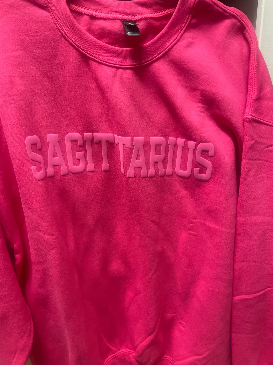 Customer photo review of Pink Zodiac Puff Print Crewneck