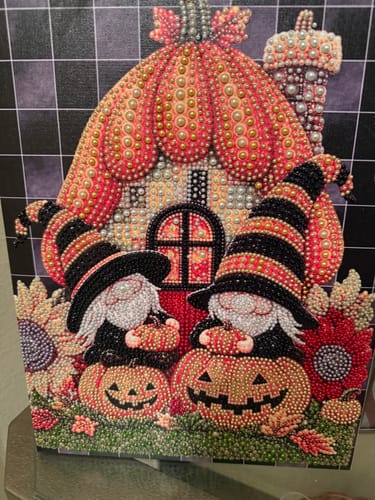 Customer's diamond painting craft featuring two colorful gnomes in witch hats sitting on pumpkins.