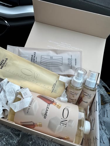 Customer's box containing metal nail file refills, bottles of cleaner, and skincare supplies.