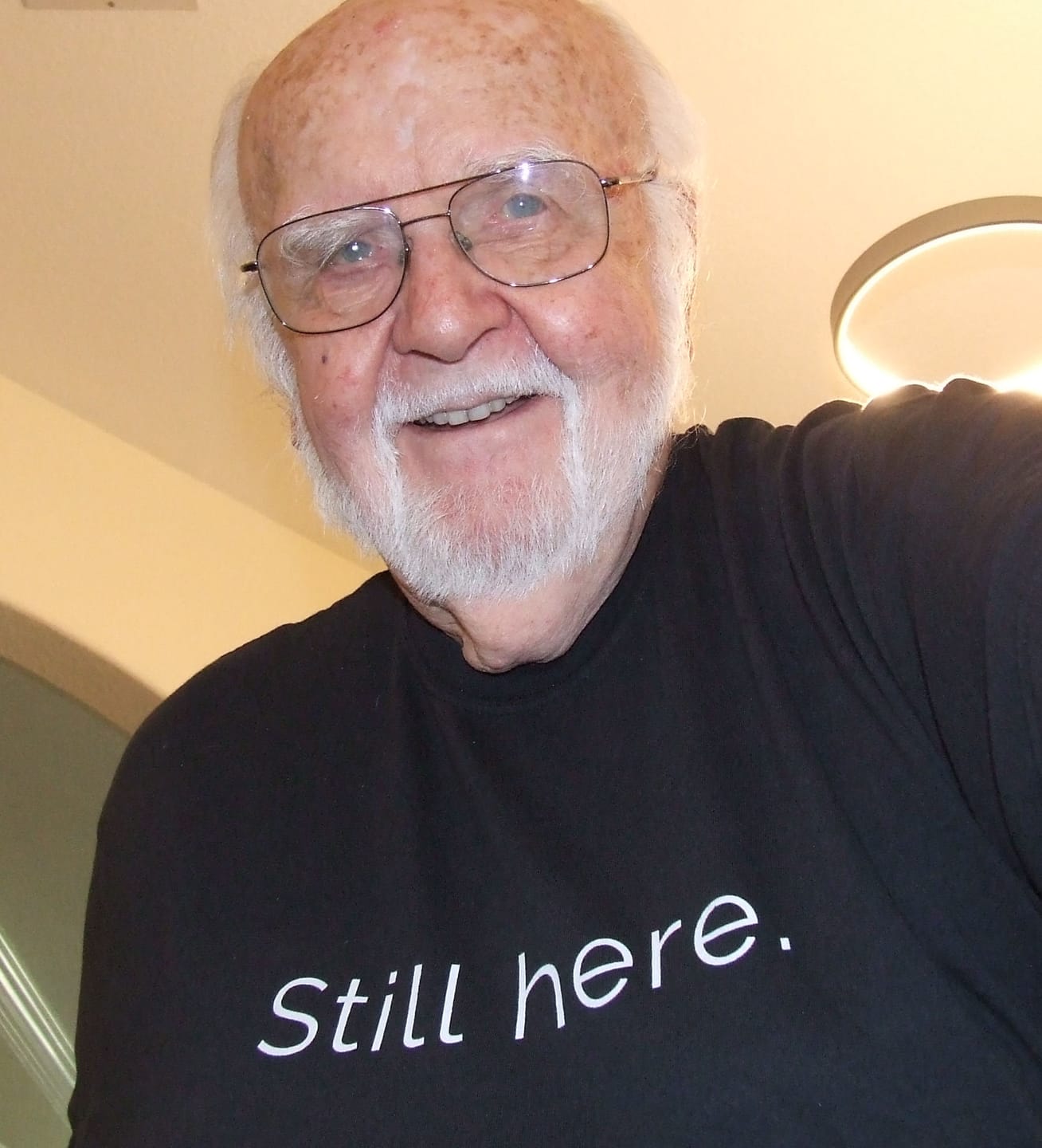 Customer photo review of My Mama Said™ “Still Here.” Unisex Comfort Tee — Quiet Strength, No Explanation Needed