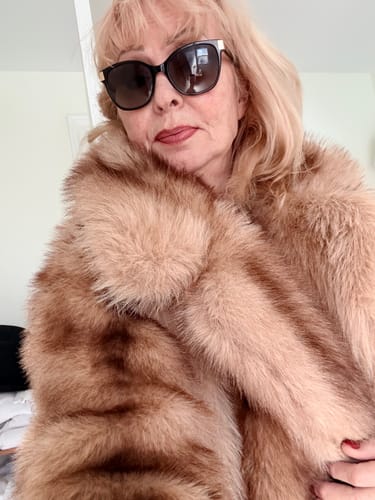 Customer's Fiona Faux Fur Coat, wearing the brown plush jacket with a turn-down collar.