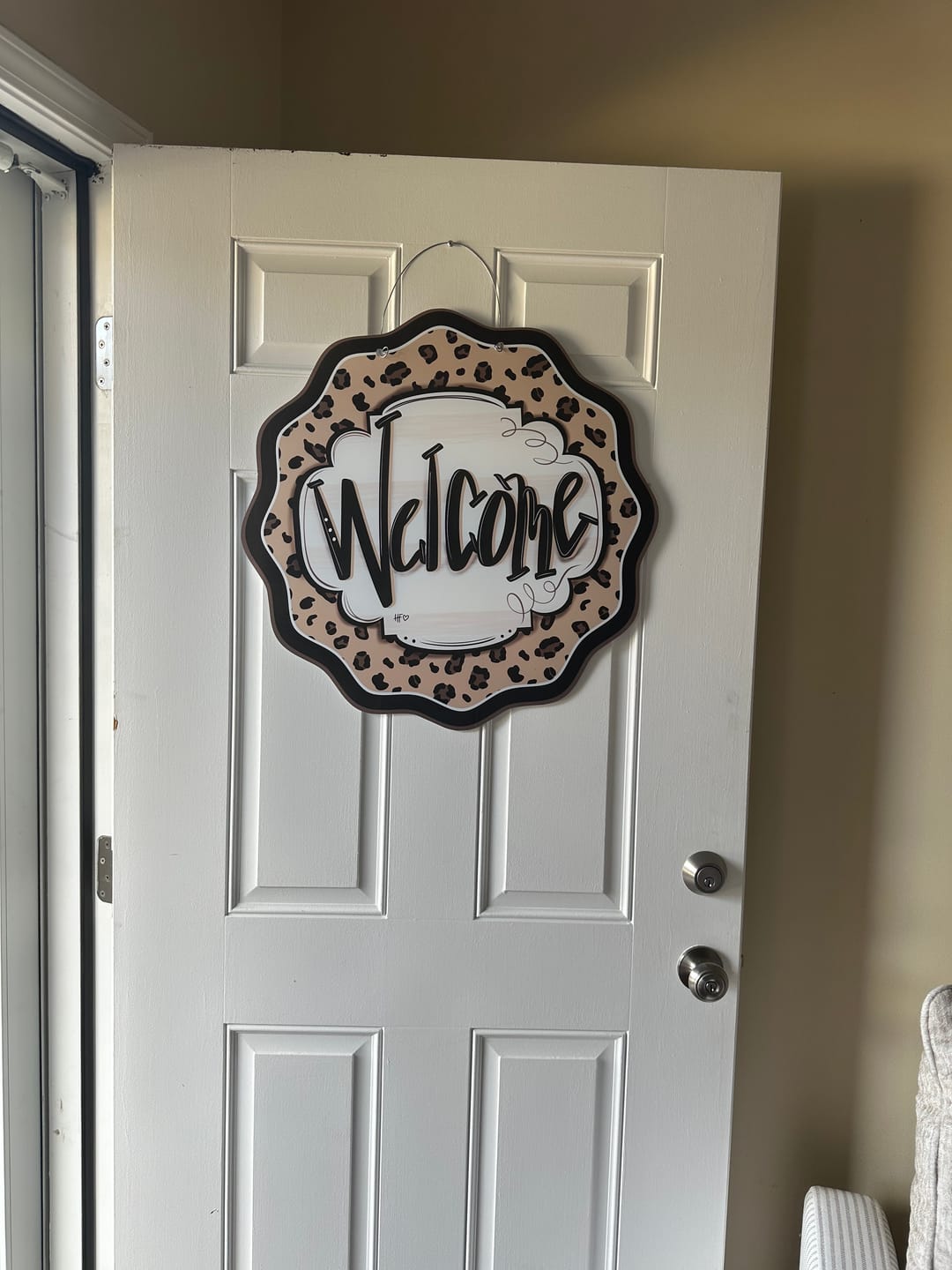Customer photo review of Leopard Cheetah Welcome Door Hanger