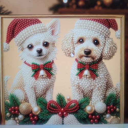 Customer's product image showing two white dogs wearing Santa hats and festive bows.