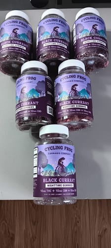 Customer's collection of six bottles of Cycling Frog Black Currant Nighttime Gummies arranged on a surface.