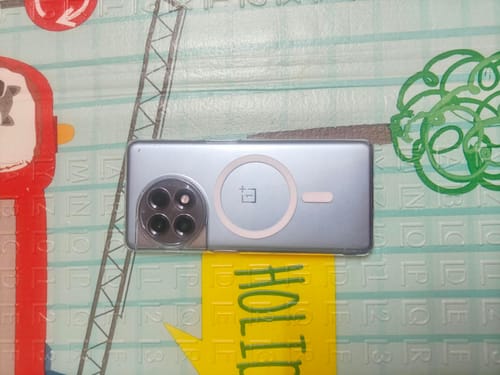 Customer's Anti Yellow Magsafe Clear Case on a phone, shown against a colorful patterned floor mat.