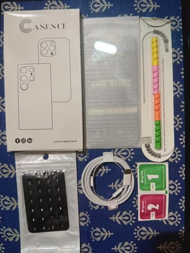 Customer's Casence Screen Cleaning Kit including a box, cleaning cloths, cable protector, charging cable, and wipe packets.