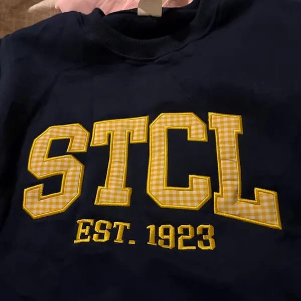 Customer photo review of Custom Patchwork Fabric Embroidered Sweatshirt Team and School Name Applique Varsity Letters