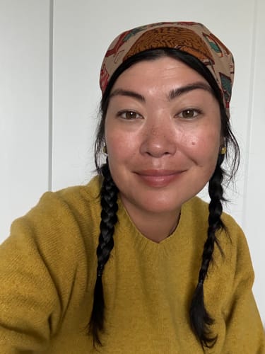 Customer's Home Bandana worn as a headwrap, featuring intricate Japanese woodblock-style patterns.