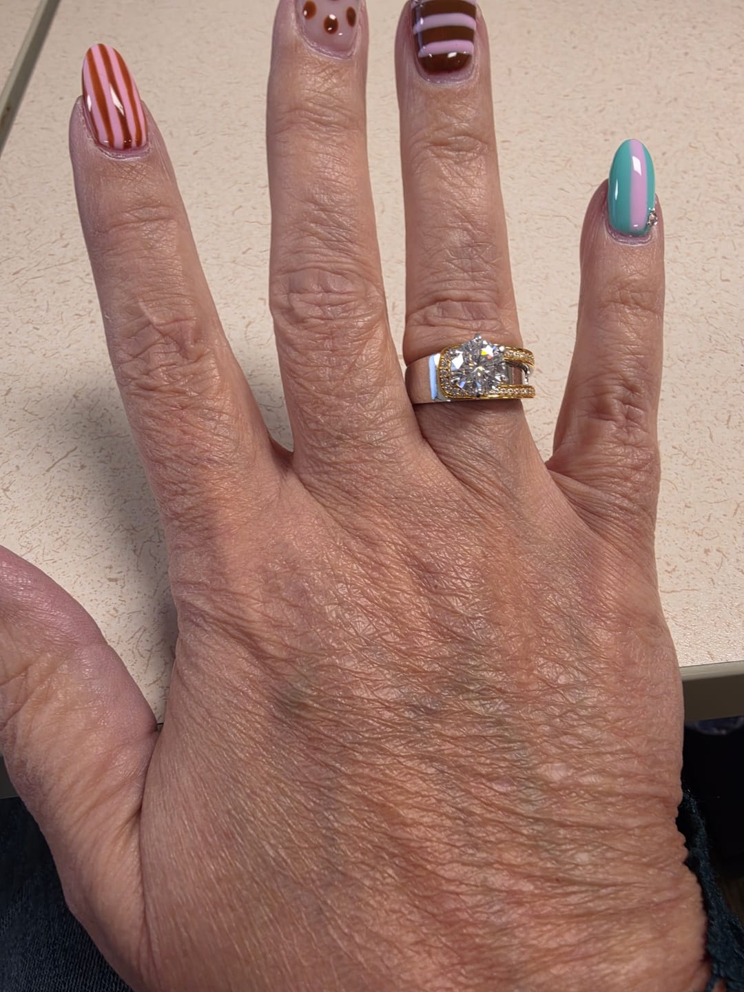 Customer photo review of Buckle Round Cut Moissanite Two Tone Engagement Ring