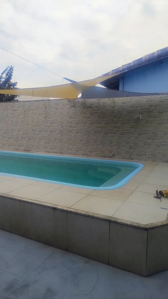 Customer photo review of Toldo Triangular Impermeável Anti-UV para Áreas Externas