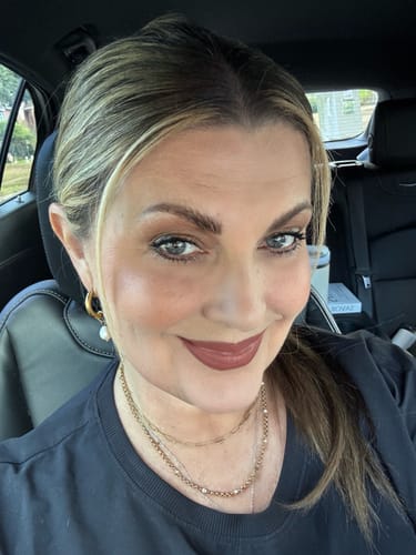 Customer's Bethany Pearl Drop Hoop earrings in gold, worn by the reviewer.