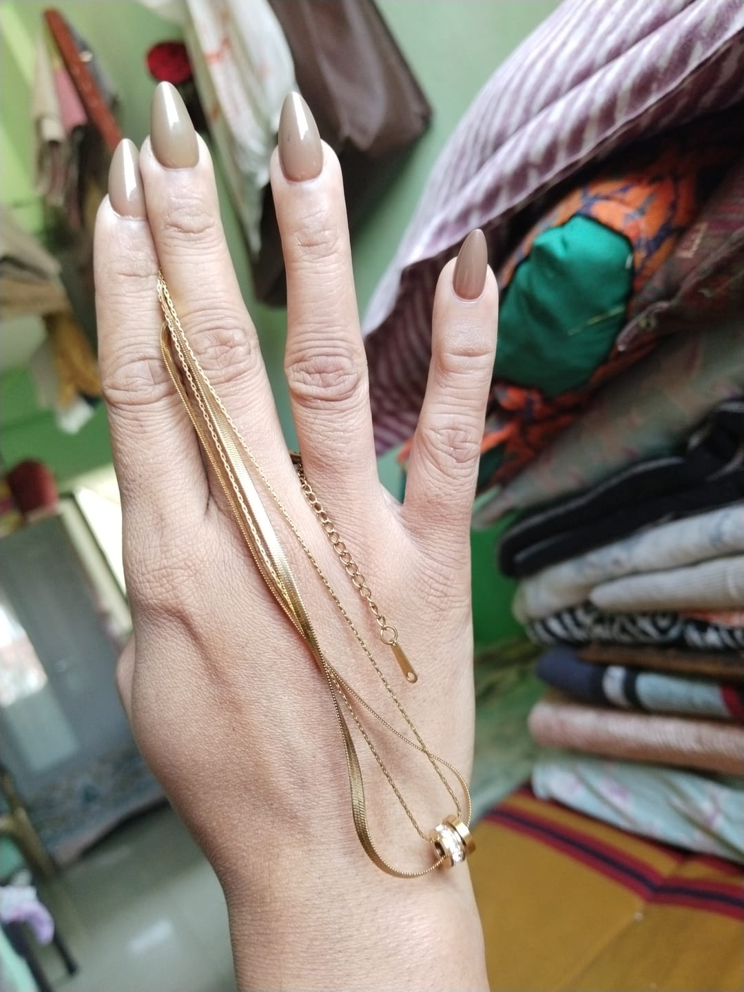 Customer photo review of Gilded Rings Layered Necklace