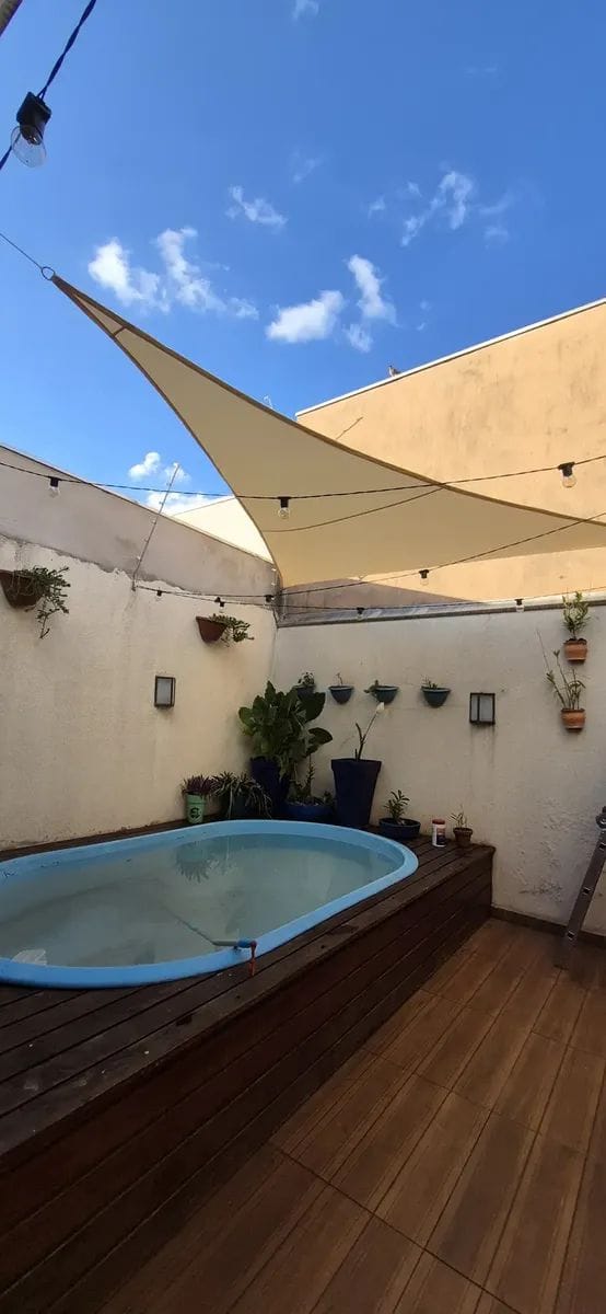 Customer photo review of Toldo Triangular Impermeável Anti-UV para Áreas Externas
