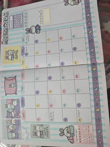 Customer's journal pages decorated with colorful Ultimate Subscription planner stickers and moon-themed washi tape.