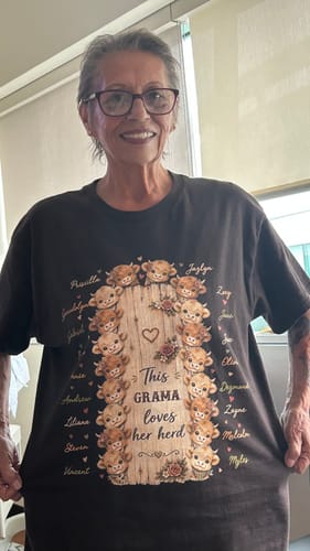 Customer's dark brown personalized Highland cow shirt, showing the This Grandma Loves Her Herd design while being worn.