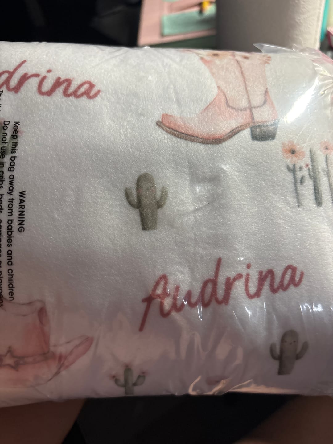 Customer photo review of Dusty Pink Cowgirl Magic personalized baby blanket