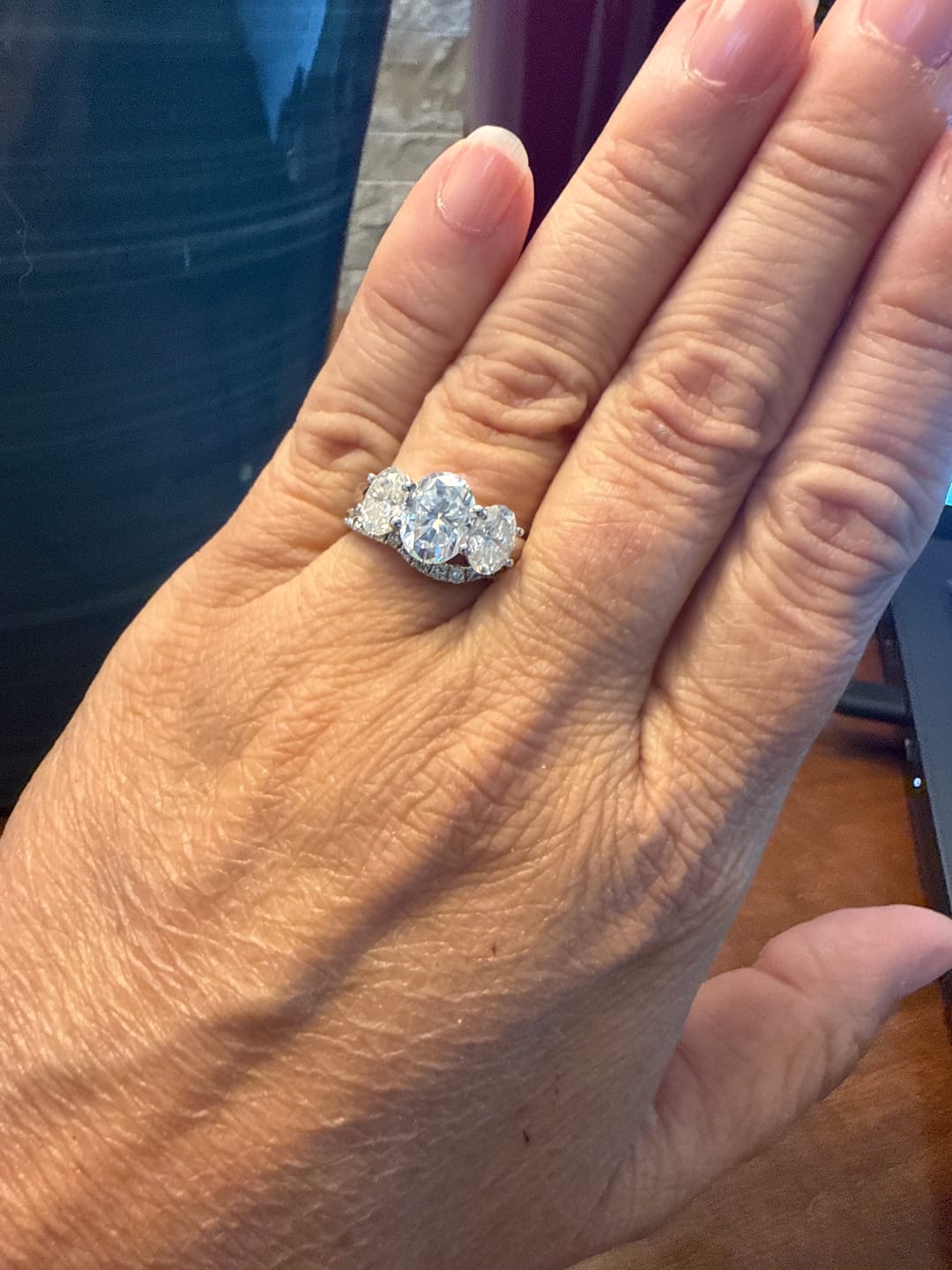 Customer photo review of Classic Three Stone Oval Cut Moissanite Engagement Ring