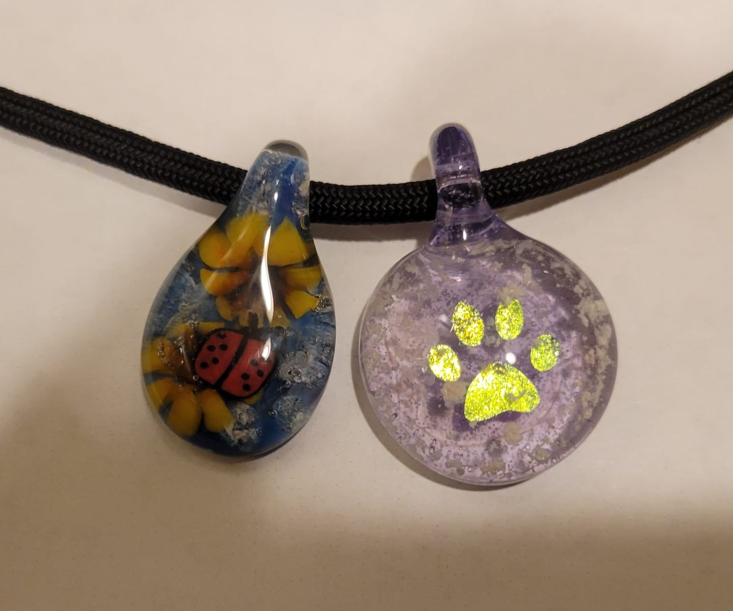 Customer photo review of Pawprint Foil Pendant with Cremation Ash