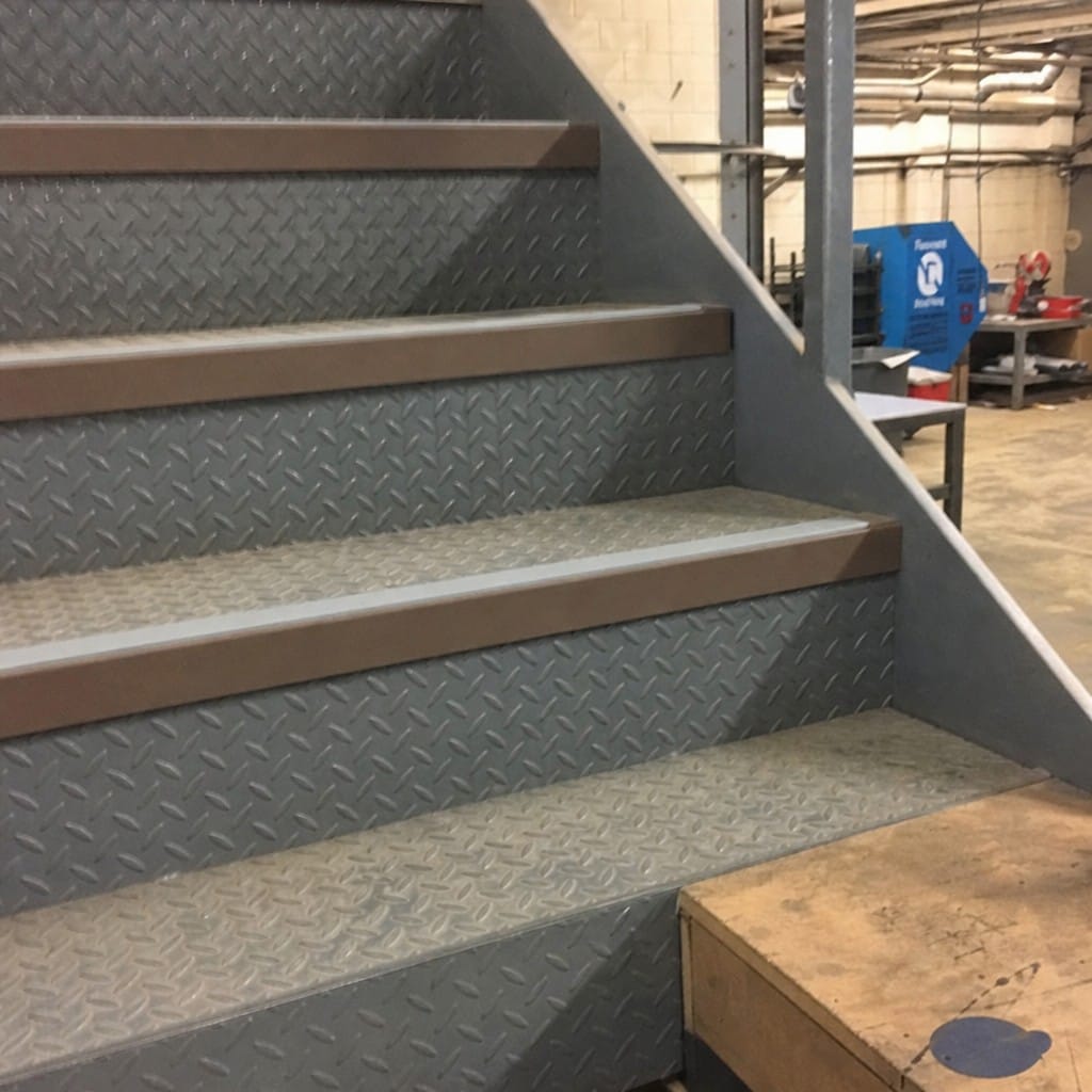 Customer photo review of Rake Back Aluminium Stair Nosing 2.44m 56mm Tread PVC Insert
