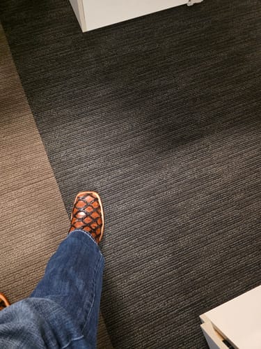 Customer's Cognac Jumbo Pirarucu boots with square toe, worn on a carpeted floor.