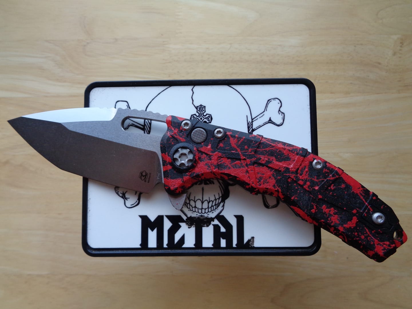 Customer photo review of Heretic Martyr Tanto Manual Knife - Black Polymer, 3.5" Stonewash MagnaCut Tanto, Button Lock - Made in USA (H057-2A)