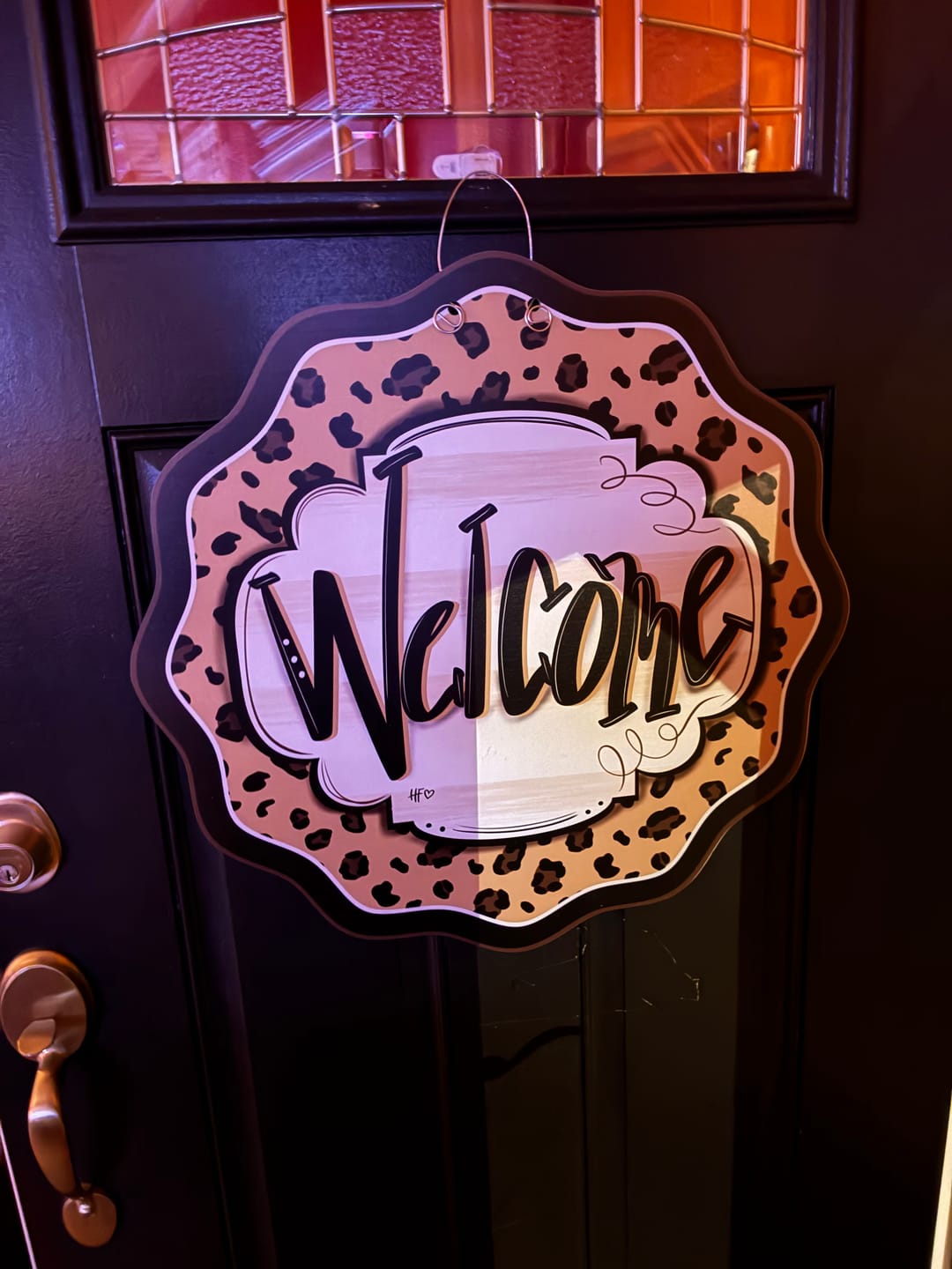 Customer photo review of Leopard Cheetah Welcome Door Hanger