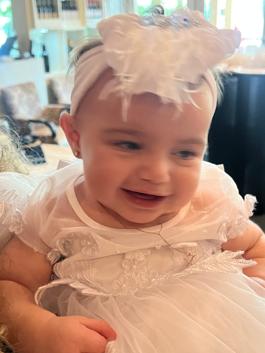 Customer photo review of Fancy Feather & Rhinestone Ruffled Baby Headband