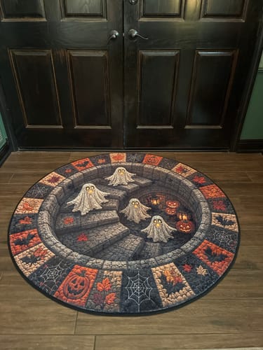 Customer's round Halloween-themed rug featuring ghostly figures on a stone staircase, placed on a wooden floor.