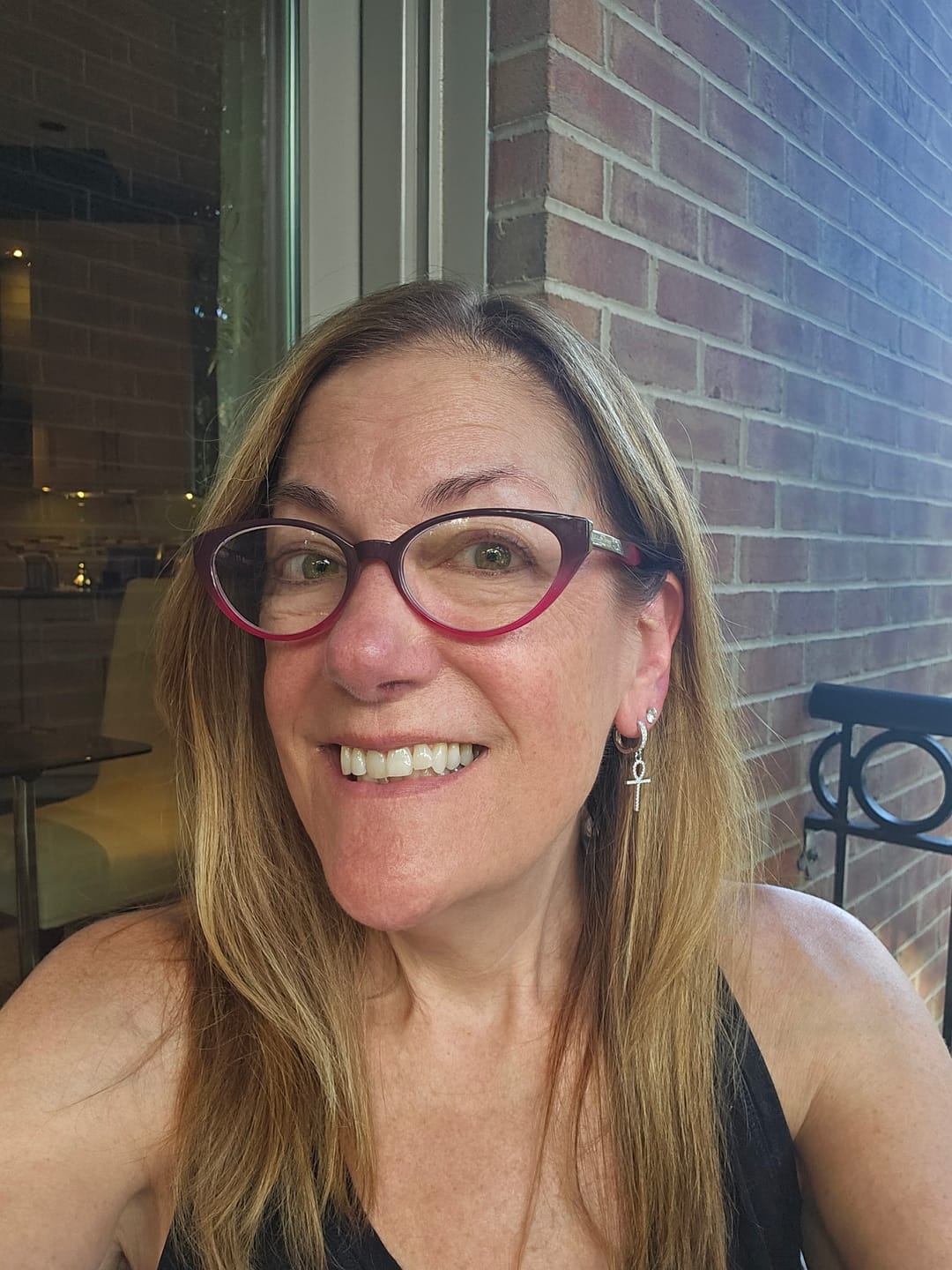 Customer photo review of Drop Ankh Moissanite Earrings 14K Gold